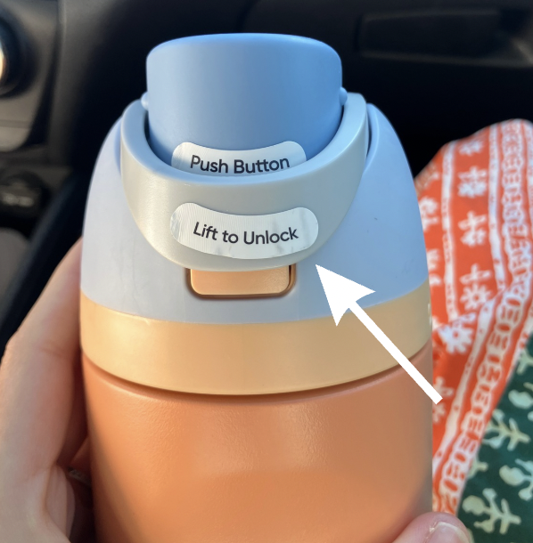 'owala closed with first sticker label saying lift to unlock'