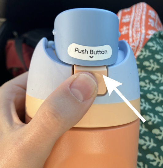 'owala handle lifted with label on button saying push button'